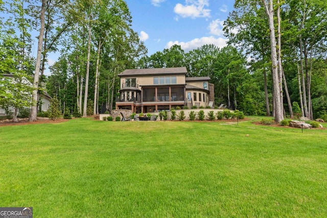 117 W View Way, Eatonton, GA 31024 - rear view of house featuring a sunroom and a yard