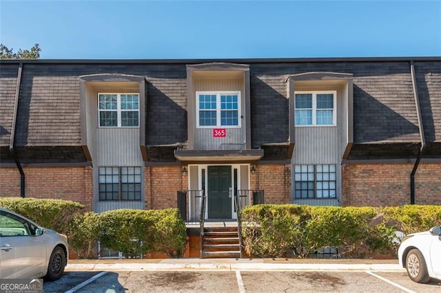365 Winding River Dr Unit # E, Atlanta, GA 30350 - multi unit property with brick siding, mansard roof, and uncovered parking