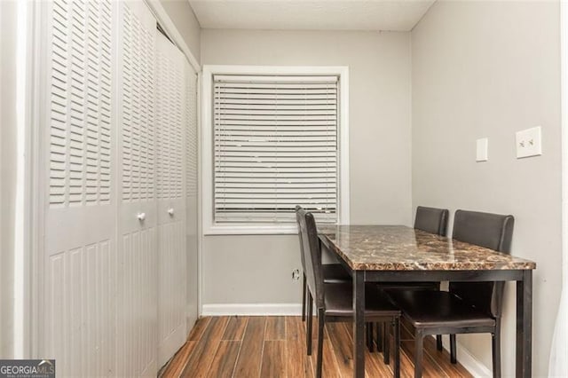 365 Winding River Dr Unit # E, Atlanta, GA 30350 - dining room featuring dark wood-style floors and baseboards