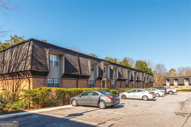 365 Winding River Dr Unit # E, Atlanta, GA 30350 - view of building exterior with uncovered parking