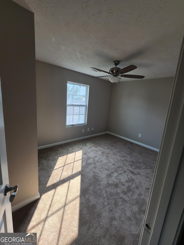 170 Inverness Trce, Riverdale, GA 30274 - carpeted empty room with ceiling fan, baseboards, and a textured ceiling