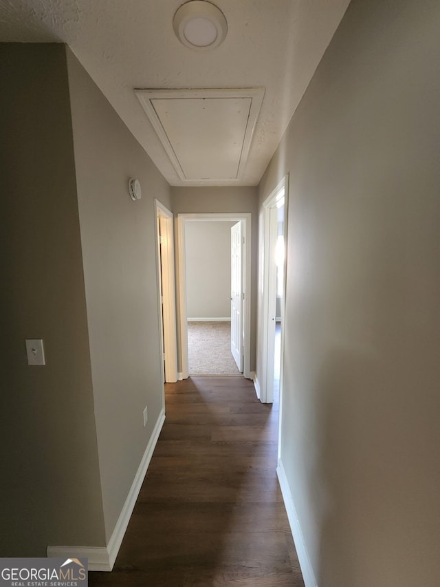 170 Inverness Trce, Riverdale, GA 30274 - corridor with attic access, baseboards, and dark wood-style floors