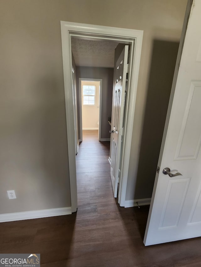 170 Inverness Trce, Riverdale, GA 30274 - hallway with baseboards and dark wood-style flooring