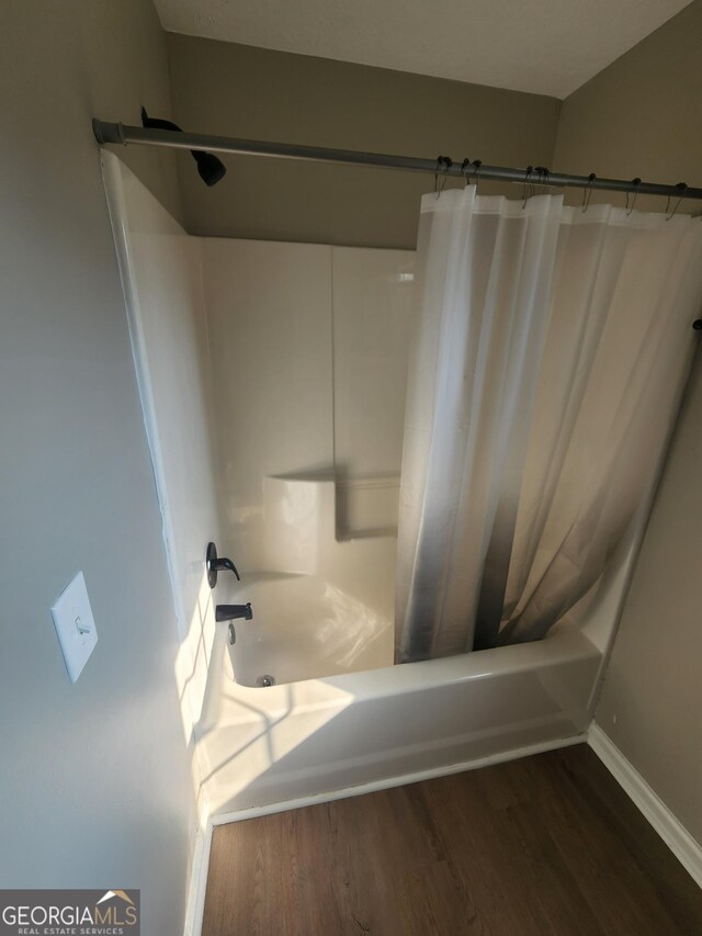 170 Inverness Trce, Riverdale, GA 30274 - bathroom with shower / bath combination with curtain, wood finished floors, baseboards, and a sink