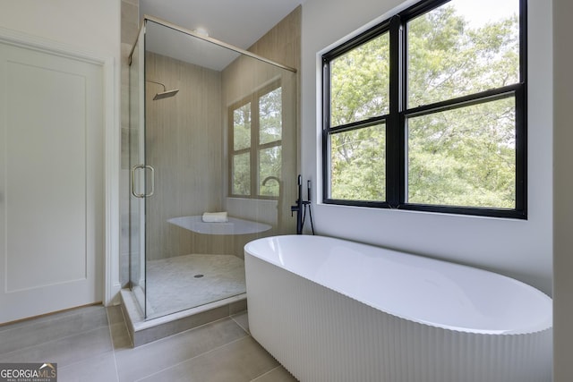 2745 S Bamby Ln NE, Brookhaven, GA 30319 - full bath featuring a freestanding tub, tile patterned flooring, and a shower stall