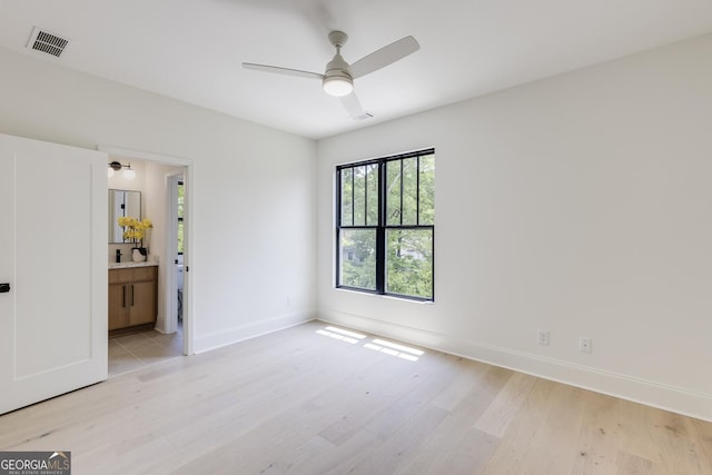 2745 S Bamby Ln NE, Brookhaven, GA 30319 - spare room with light wood-style flooring, a ceiling fan, and baseboards