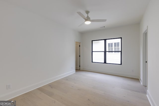 2745 S Bamby Ln NE, Brookhaven, GA 30319 - unfurnished room featuring light wood finished floors, baseboards, and a ceiling fan
