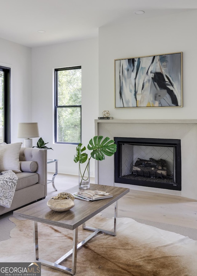 2745 S Bamby Ln NE, Brookhaven, GA 30319 - living room with plenty of natural light, a fireplace, and wood finished floors