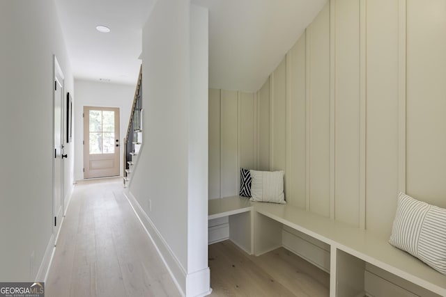 2745 S Bamby Ln NE, Brookhaven, GA 30319 - corridor with light wood-style flooring, stairway, and baseboards