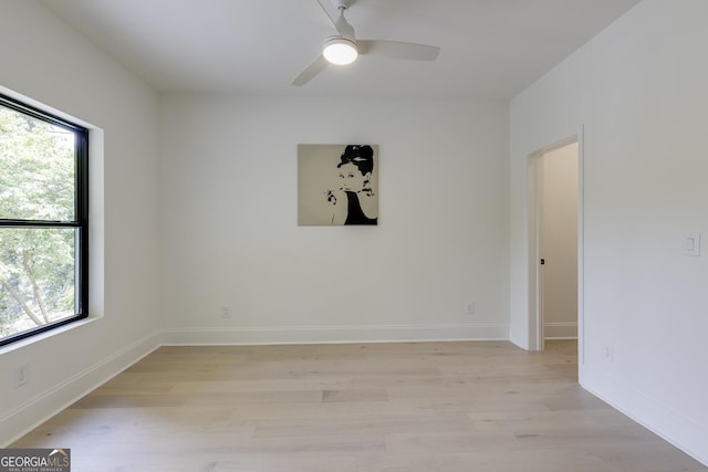 2745 S Bamby Ln NE, Brookhaven, GA 30319 - unfurnished room with healthy amount of natural light, light wood-style flooring, and a ceiling fan