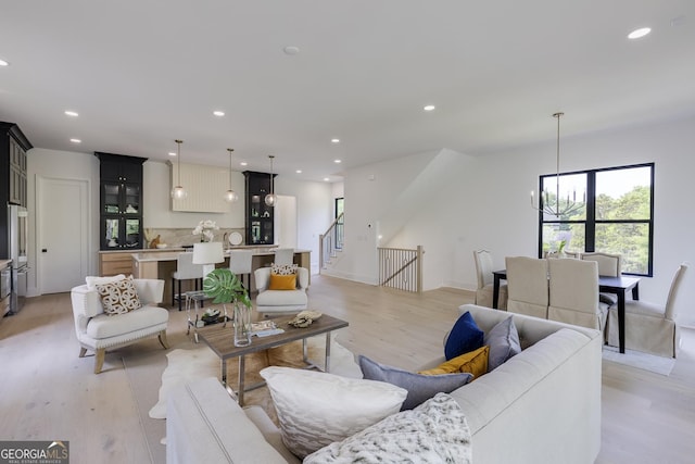 2745 S Bamby Ln NE, Brookhaven, GA 30319 - living area featuring light wood-type flooring, recessed lighting, and stairway