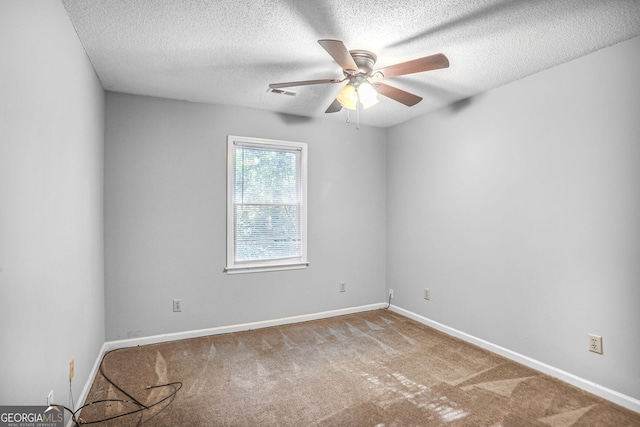 1417 Poplar Pointe SE, Smyrna, GA 30082 - spare room with a ceiling fan, carpet floors, a textured ceiling, and baseboards