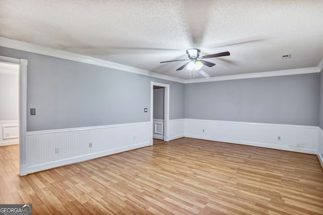 1417 Poplar Pointe SE, Smyrna, GA 30082 - unfurnished room with light wood finished floors, ceiling fan, a wainscoted wall, ornamental molding, and a textured ceiling