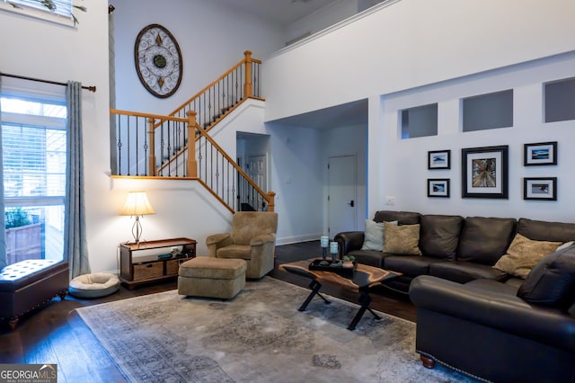 8035 Magnolia Way, Roswell, GA 30075 - living area with a high ceiling, wood-type flooring, stairs, and baseboards