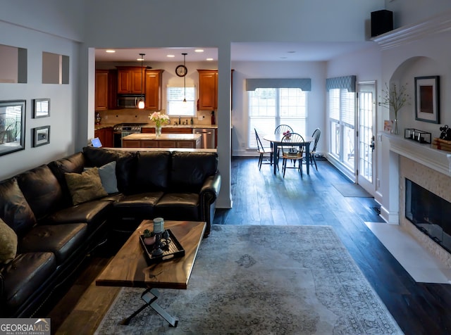 8035 Magnolia Way, Roswell, GA 30075 - living area with dark wood-style flooring, recessed lighting, and a fireplace with flush hearth