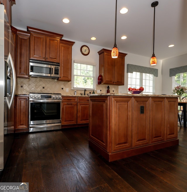 8035 Magnolia Way, Roswell, GA 30075 - kitchen featuring appliances with stainless steel finishes, dark wood-style floors, tasteful backsplash, recessed lighting, and light stone counters