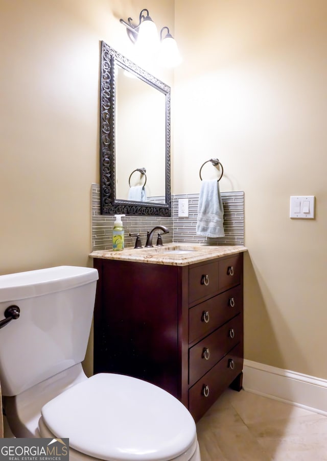 8035 Magnolia Way, Roswell, GA 30075 - half bathroom featuring toilet, vanity, decorative backsplash, and baseboards