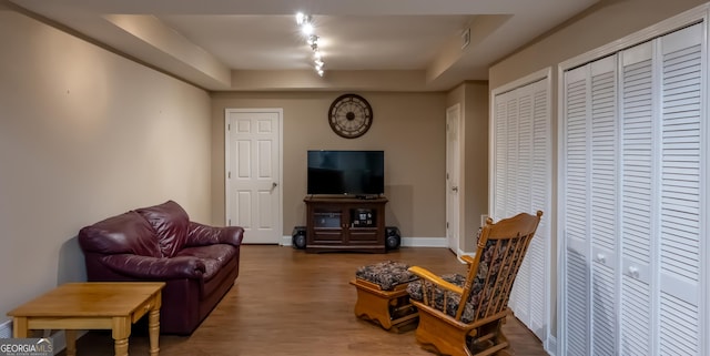 8035 Magnolia Way, Roswell, GA 30075 - living room featuring wood finished floors, track lighting, and baseboards