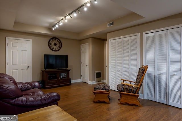 8035 Magnolia Way, Roswell, GA 30075 - living area featuring a tray ceiling, baseboards, and wood finished floors