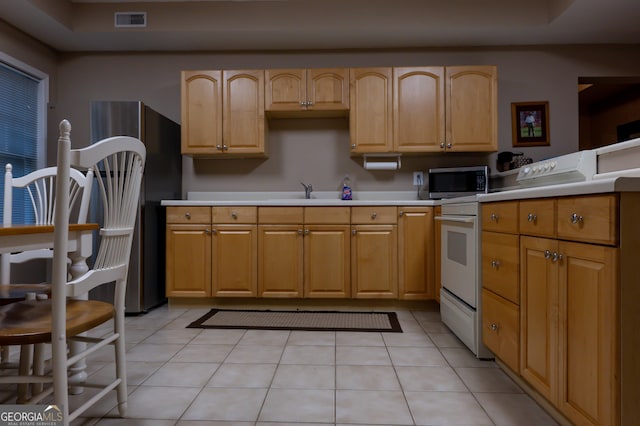 8035 Magnolia Way, Roswell, GA 30075 - kitchen with appliances with stainless steel finishes, light countertops, light tile patterned flooring, and a sink