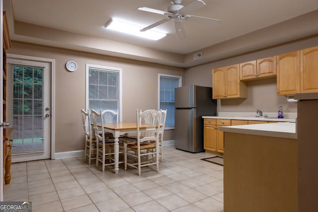 8035 Magnolia Way, Roswell, GA 30075 - kitchen featuring freestanding refrigerator, light brown cabinetry, light countertops, light tile patterned flooring, and a sink