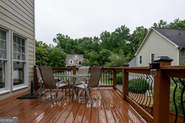 8035 Magnolia Way, Roswell, GA 30075 - deck with outdoor dining area, a grill, and view of wooded area