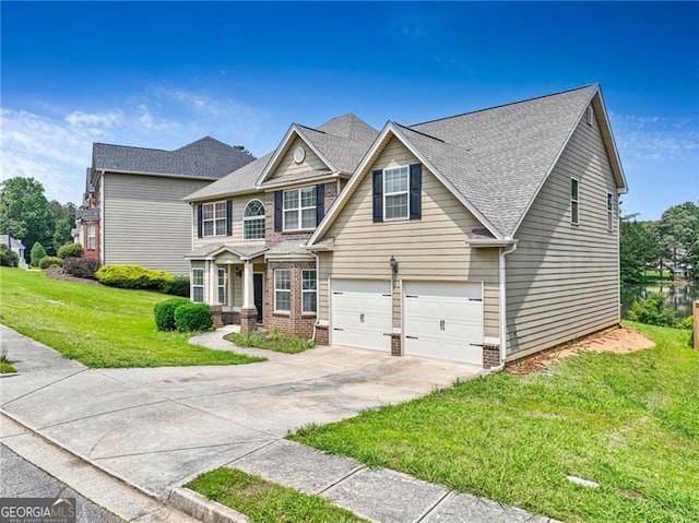 766 Chapman St, Jonesboro, GA 30238 - view of front of property featuring an attached garage, brick siding, a front lawn, driveway, and a shingled roof