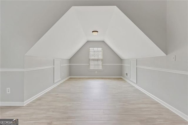 766 Chapman St, Jonesboro, GA 30238 - bonus room featuring wood finished floors, baseboards, and lofted ceiling