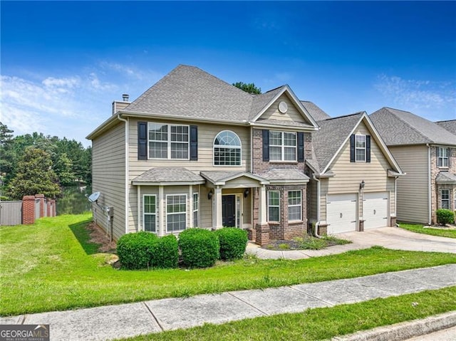 766 Chapman St, Jonesboro, GA 30238 - view of front of house with driveway, a front lawn, brick siding, an attached garage, and a chimney