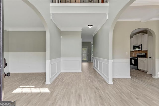 766 Chapman St, Jonesboro, GA 30238 - entryway with ornamental molding, light wood finished floors, and wainscoting