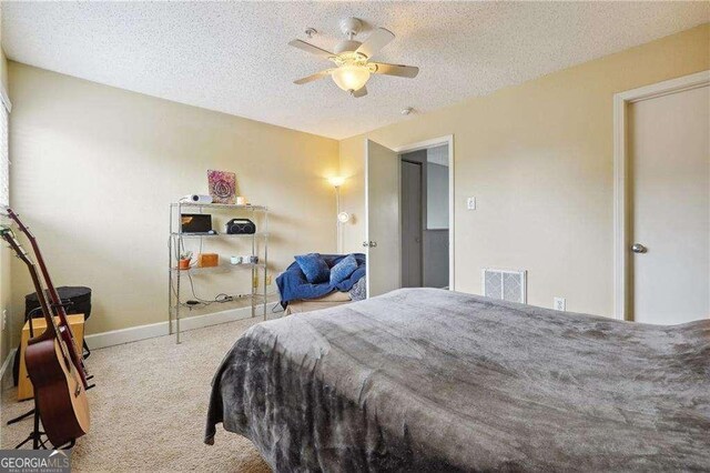 377 Ralph Mcgill Blvd NE Unit C, Atlanta, GA 30312 - carpeted bedroom featuring a textured ceiling and a ceiling fan