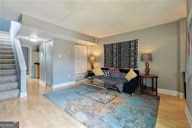 377 Ralph Mcgill Blvd NE Unit C, Atlanta, GA 30312 - living room featuring stairs and wood finished floors