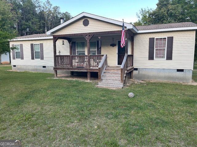 1167 Underwood, Sparta, GA 31087 - manufactured / mobile home with crawl space, a porch, and a front yard