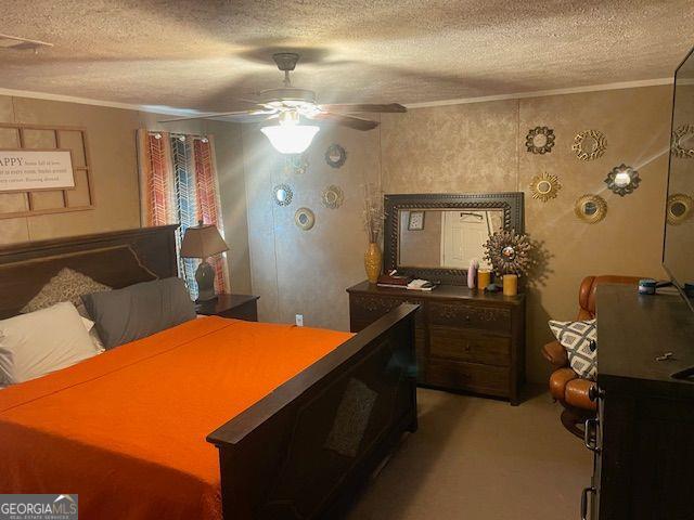 1167 Underwood, Sparta, GA 31087 - bedroom featuring ornamental molding, a textured ceiling, light colored carpet, a ceiling fan, and a desk