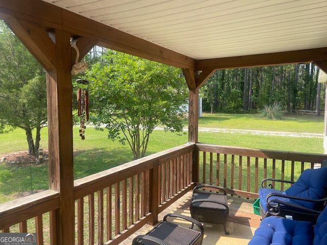 1167 Underwood, Sparta, GA 31087 - wooden terrace with a lawn