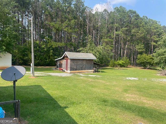 1167 Underwood, Sparta, GA 31087 - view of green lawn with a forest view