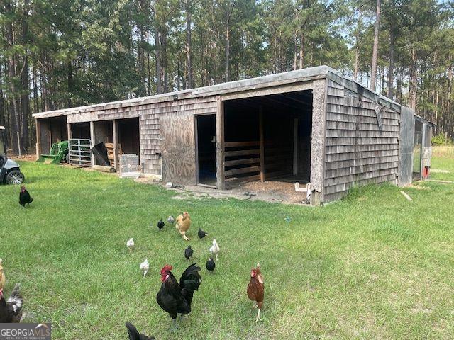 1167 Underwood, Sparta, GA 31087 - view of outbuilding featuring an exterior structure and view of scattered trees