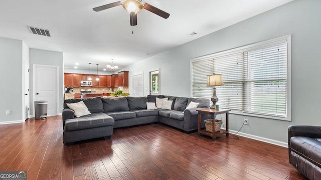 572 Boulder View Pkwy, Dallas, GA 30157 - living room featuring dark wood-style floors, ceiling fan, baseboards, and a chandelier