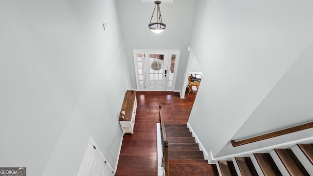 572 Boulder View Pkwy, Dallas, GA 30157 - staircase featuring hardwood / wood-style flooring, a high ceiling, and baseboards