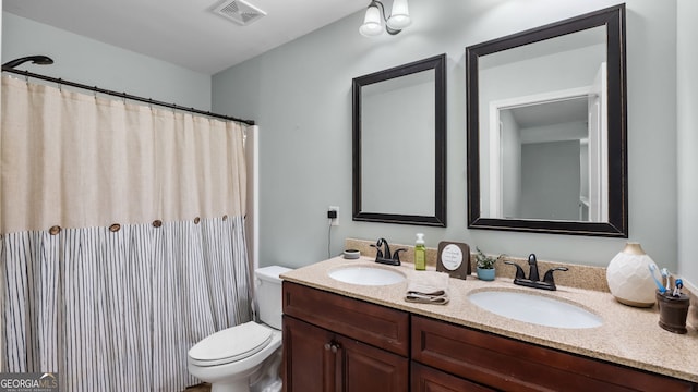 572 Boulder View Pkwy, Dallas, GA 30157 - bathroom with toilet, double vanity, and a shower with shower curtain