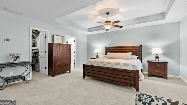 572 Boulder View Pkwy, Dallas, GA 30157 - bedroom featuring a raised ceiling, light colored carpet, a spacious closet, and baseboards