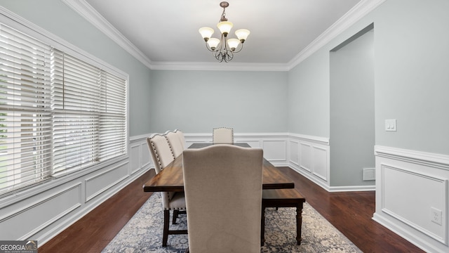 572 Boulder View Pkwy, Dallas, GA 30157 - dining room with a chandelier, crown molding, wood finished floors, wainscoting, and a decorative wall