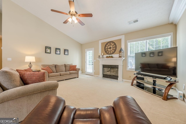 2870 Jay Oak Dr, Dacula, GA 30019 - living room with carpet flooring, ceiling fan, a fireplace with flush hearth, baseboards, and high vaulted ceiling