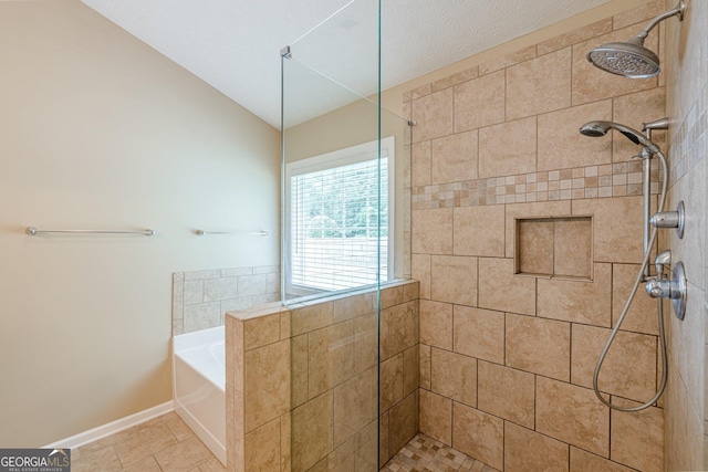 2870 Jay Oak Dr, Dacula, GA 30019 - bathroom with a garden tub, a tile shower, lofted ceiling, and baseboards