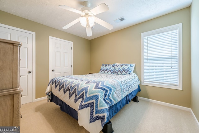 2870 Jay Oak Dr, Dacula, GA 30019 - carpeted bedroom featuring baseboards, multiple windows, and a ceiling fan