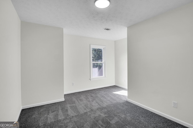 1172 Rockmart Cir NW, Kennesaw, GA 30144 - unfurnished room featuring dark colored carpet and a textured ceiling