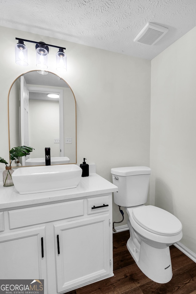 1172 Rockmart Cir NW, Kennesaw, GA 30144 - bathroom featuring wood finished floors, vanity, and a textured ceiling