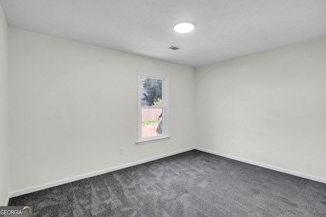 1172 Rockmart Cir NW, Kennesaw, GA 30144 - unfurnished room featuring dark colored carpet and baseboards