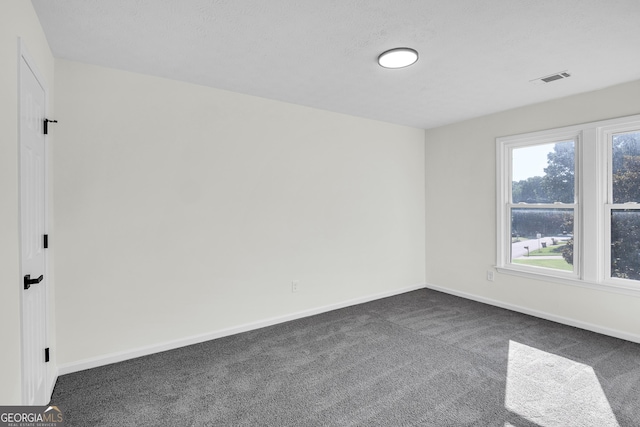 1172 Rockmart Cir NW, Kennesaw, GA 30144 - spare room with dark colored carpet and baseboards
