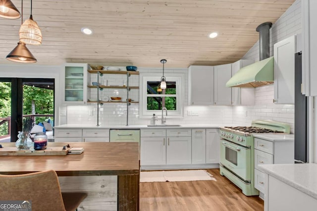 14905 Thompson Rd, Milton, GA 30004 - kitchen with gas range oven, a sink, wooden ceiling, light wood finished floors, and decorative backsplash